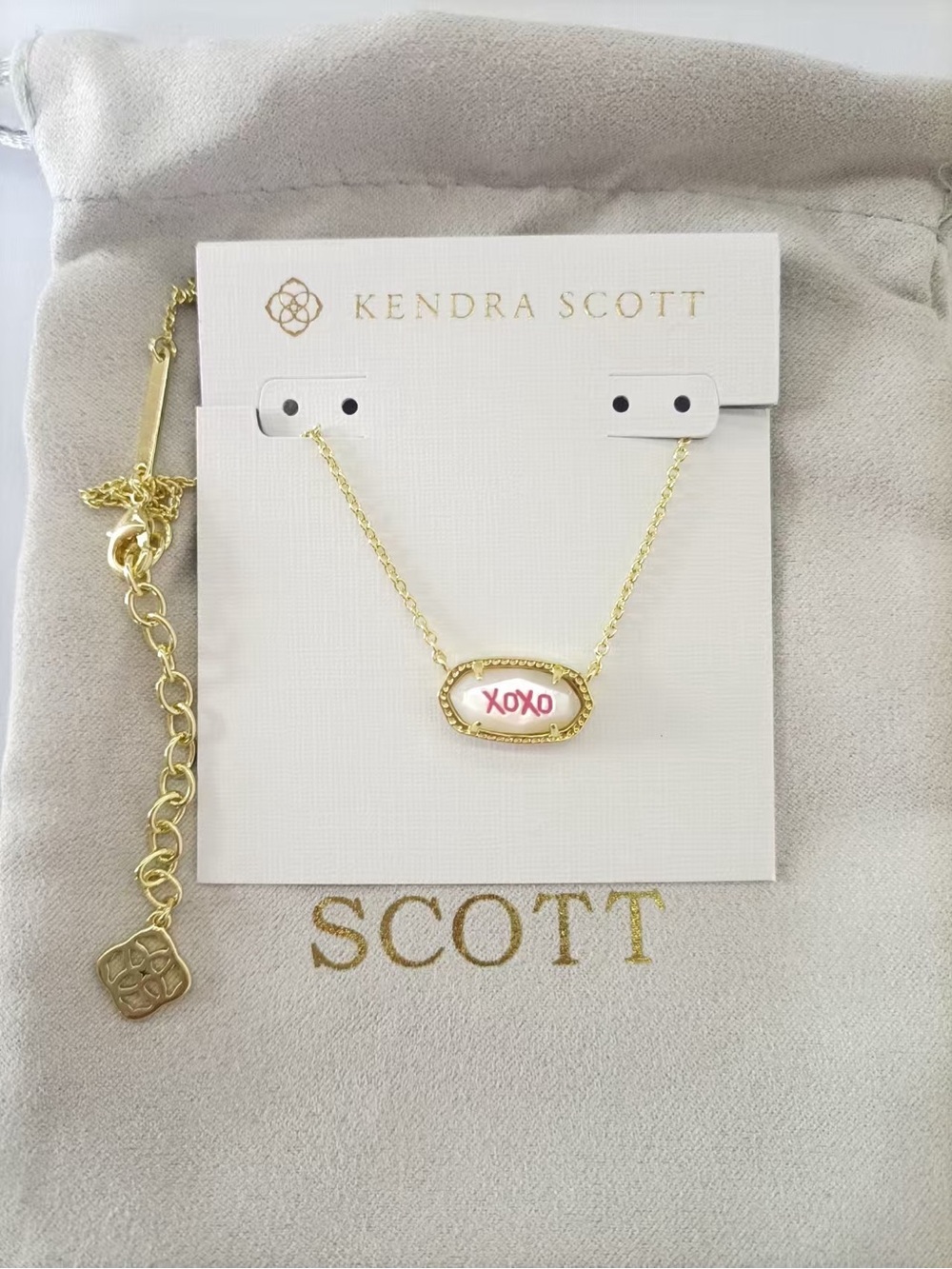 Kendra Scott Gold Oval Necklace with White and Pink Enamel 'XOXO'